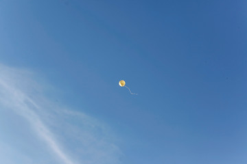 yellow balloon in the blue sky