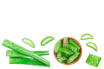 Aloe vera with slices in wooden bowl isolated on white background with copy space for your text. Top view. Flat lay.