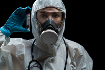 Woman Doctor wearing hazmat suits with swab collection kit in the laboratory.