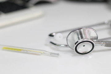 Stethoscope isolated equipment on white texture with blurred background