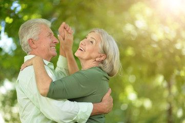 Fototapeta premium Beautiful senior couple dancing in the park