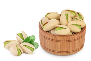 pistachio in wooden bowl isolated on white background with clipping path and full depth of field