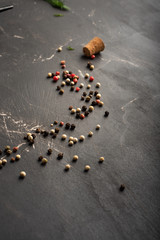 Scattered peppercorns on a kitchen table