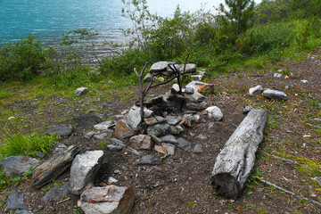 hearth of stones for tourist campfire in campsite, outdoor recreation