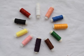 A set of threads on a white background.
