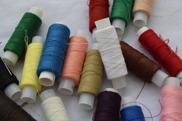 A set of threads on a white background.