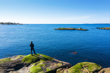 Fototapeta na wymiar Man on the shore of the Baltic sea. Top view.