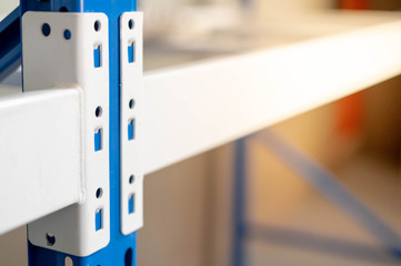 The angle of metal rack preparing to assembling  in warehouse or storage and shelves for put cardboard boxes of products.