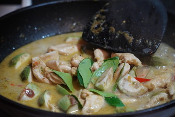 Spicy chicken in a sauce of coconut milk close-up in a frying pan,Stay at home
