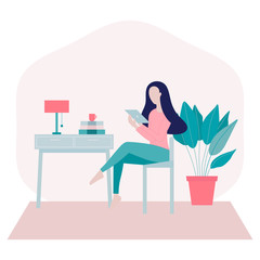 Stay home concept.Young woman sitting on a chair at home and surfing on internet,shopping online using her tablet in period of self isolation and social distancing during Covid-19 epidemic.