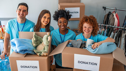 Helpful team of social workers. Group of mixed race people working in charitable foundation. Small...