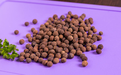 Black pepper and parsley on the table.