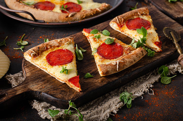 Homemade salami pizza with cheese corners