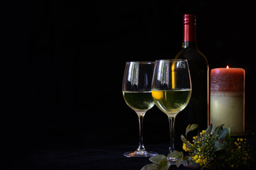 Background for celebrations, wine glasses and wine bottles on a black background