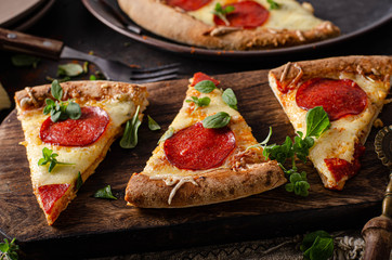 Homemade salami pizza with cheese corners
