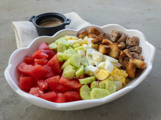 Tuna salad with crackers, tomatoes, cucumbers, boiled eggs