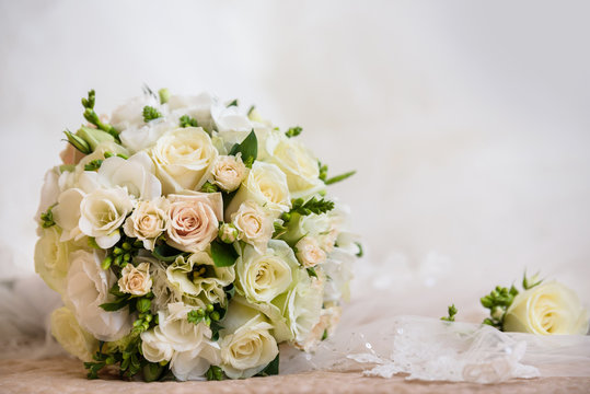 Bridal wedding bouquet in white and beige colours. Tenderness fashion bouquet