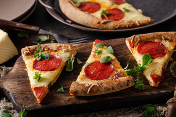 Homemade salami pizza with cheese corners