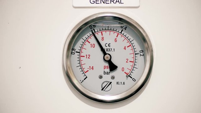 Barometer measuring pressure in industry. We can see the pressure gauge going up and down 