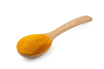 Yellow turmeric powder in a wooden spoon isolated on white background