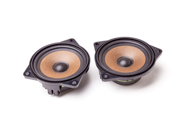 Pair of speakers of an acoustic system - an audio for playing music in a car interior on a white...