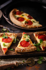 Homemade salami pizza with cheese corners