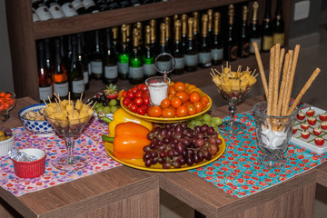 Appetizers among decorative fruits and vegetables