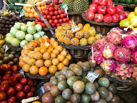 Bowls of fruit and vegetables on a table in a farmers’ market