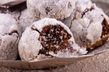 Traditional Christmas almond chocolate snowballs cookies biscuits covered icing sugar powder. Russian Tea Cakes, Mexican Wedding Cookies, Butterballs. Christmas New Year festive ornament decorations.