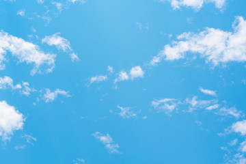Fototapeta na wymiar blue sky background with tiny clouds.
