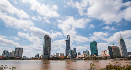 Fototapeta na wymiar Saigon skyline and the Saigon River with Bitexco tower. Ho Chi Minh City is a popular tourist destination of Vietnam.