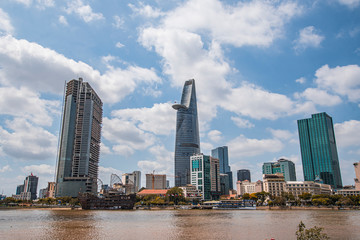 Obraz premium Saigon skyline and the Saigon River with Bitexco tower. Ho Chi Minh City is a popular tourist destination of Vietnam.