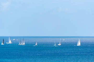 White and Blue Sailing boats in the Sea at fishing Regatta