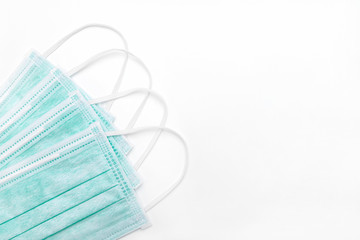 Sanitizer gel or antibacterial soap and medical surgical mask for coronavirus preventive measure on white background.