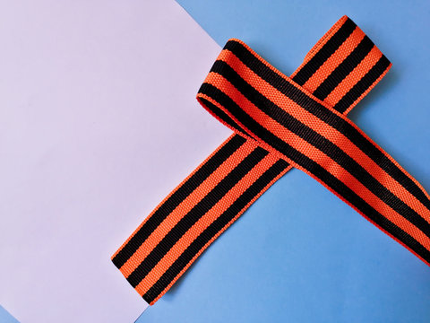 St. George ribbon in the form of a bow on a blue and white background