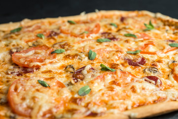 pizza on a plate with black background