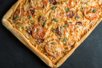 pizza on a plate with black background