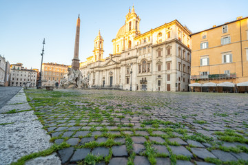 Obraz premium Piazza Navona in Rome appears like a ghost city during the covid emergency lock down, grass on the floor