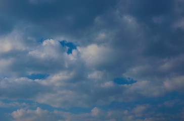 blue sky with dark clouds