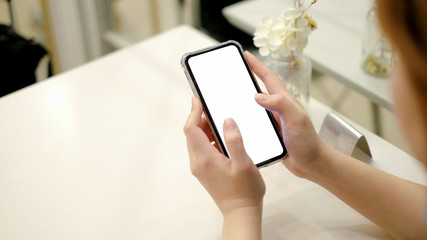 girl using smartphone in cafe. white screen.