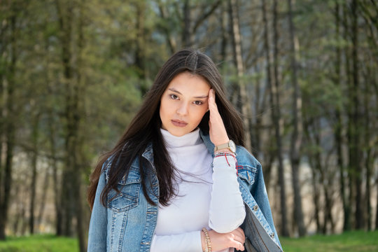 Happy young woman flerting with the camera