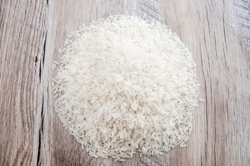 a pile of white long rice. Indian rice groats. View from above.