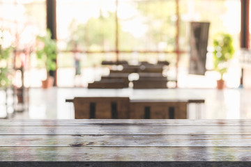 3D Rendering, Wooden top table with bokeh light effect and blur restaurant on background, blur background
