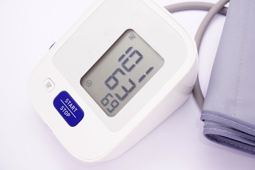 Blood pressure monitor on white background