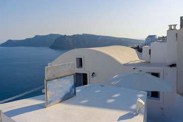 Roof of hotels on the background of the Mediterranean Sea on the island of Santorini, Oia village.