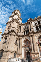 Low-angle view of the main facade of the Roman Catholic Cathedral of Málaga in southern Spain.