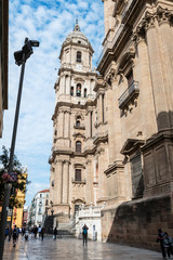Fototapeta na wymiar Low-angle view of the main facade of the Roman Catholic Cathedral of Málaga in southern Spain.