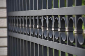 Close up of black metal fence