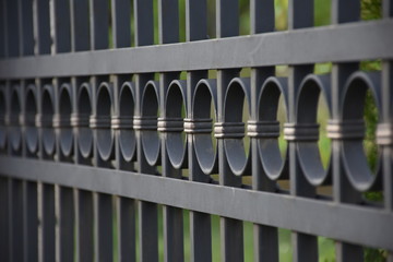Close up of black metal fence
