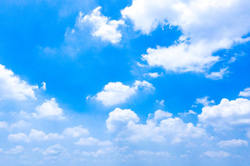 Cotton like white clouds floating on blue sky background